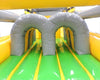 Image of Dual tunnel entry inside green-floored inflatable obstacle course designed for races and crawl-through play