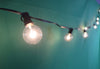 Image of Monaco 25-Foot String Light Set with 25 G40 Incandescent Bulbs with Black Cord for Indoor & Outdoor Use