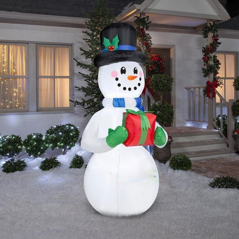 Gemmy Inflatables Lawn Ornaments & Garden Sculptures 9' Snowman w/ Christmas Present by Gemmy Inflatables 6 1/2' Snowman w/ Blue Scarf Holding Present Gemmy Inflatables