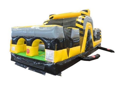 Angled view of the Venom inflatable obstacle course rental with dual lanes and bright yellow and black design