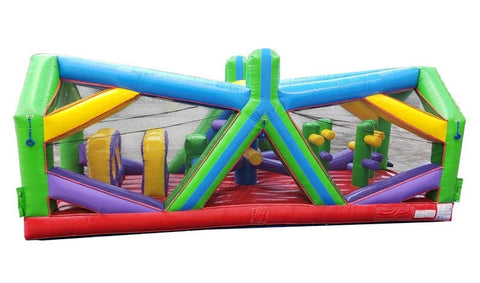 Wide side view showing vibrant green, yellow, and purple inflatable obstacle course with interior pop-ups