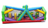 Image of Wide side view showing vibrant green, yellow, and purple inflatable obstacle course with interior pop-ups